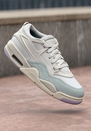 White sneaker with light blue suede accents, textured mesh upper, lace closure, and translucent purple air cushioning sole.