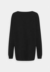 Pull noir à manches longues en maille avec poignets et ourlet côtelés, vu de dos sur un fond clair uni.