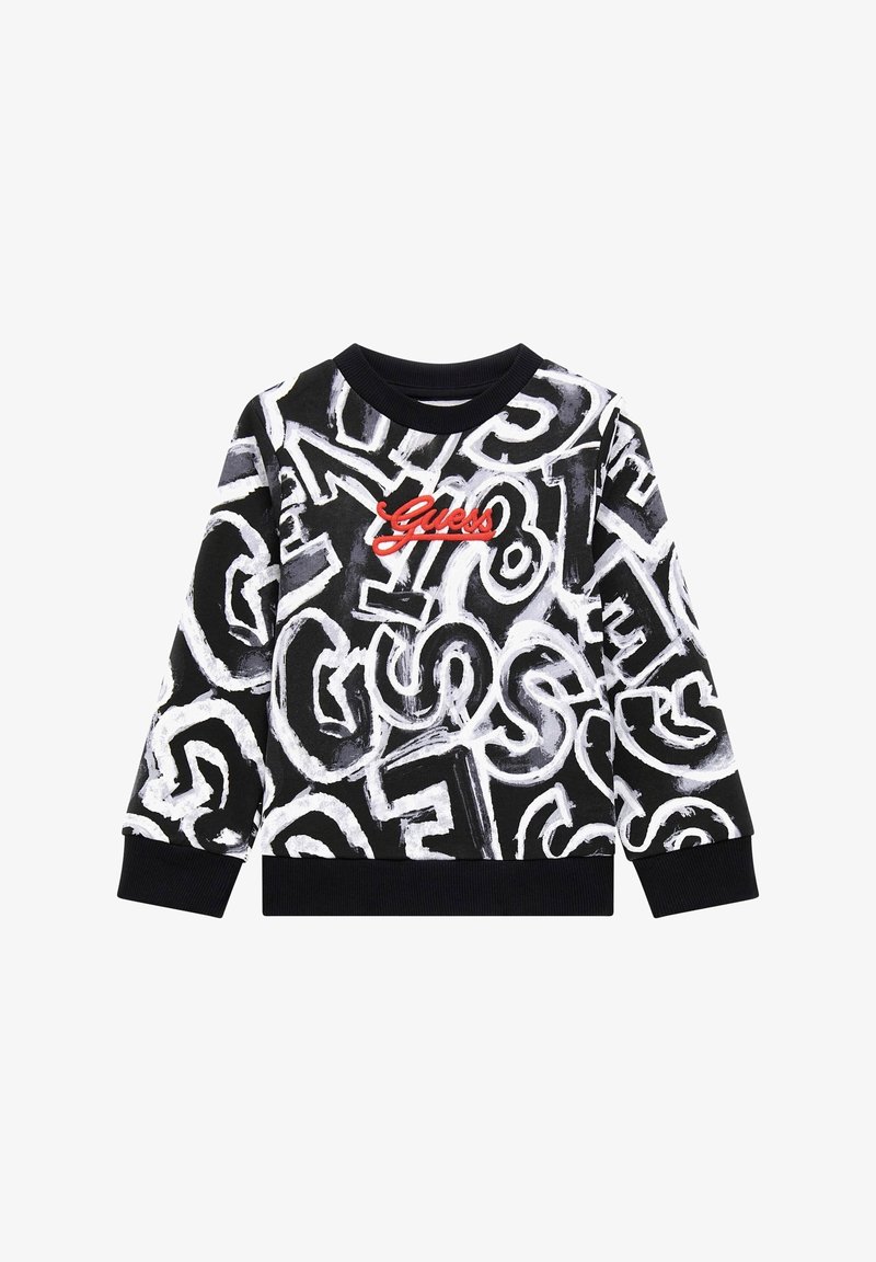 Sweat-shirt noir avec des lettres blanches style graffiti et un logo rouge « Guess » centré sur la poitrine, avec poignets et ourlet côtelés.