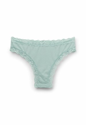 Helles mintgrünes Baumwollthong mit Spitzenbesatz entlang der Taille und Beinöffnungen, ausgestattet mit einer glatten Textur und zarten gewellten Kanten.