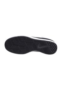 Black rubber sole with a herringbone pattern, featuring a white midsole and a visible Nike logo. Clean, textured finish with no prominent accents.