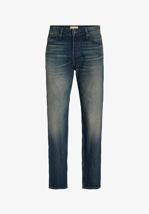 Tmavo modré džínsy s rovný strihom, vyblednutými miestami, piatimi vreckami a zipsom. Obsahujú jemné prešitie a klasický vzhľad.