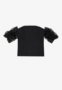Svart crop top med strukturert liv og gjennomsiktige, volangede tyllermuffer. Glatt stoff med en tettsittende fasong.