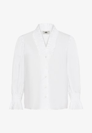 Blusa bianca con scollatura a V, colletto arricciato e maniche lunghe a sbuffo. Presenta bottoni lungo la parte anteriore e polsini arricciati. Tessuto con una consistenza liscia.