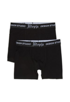 Dos calzoncillos bóxer negros con cinturillas elásticas negras con texto blanco que dice ""Utopia Design Studio"" sobre un fondo blanco.