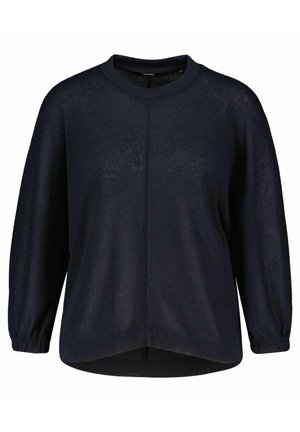 Maglione a maglia blu scuro con maniche lunghe e leggermente arricciate, scollatura rotonda e orlo curvo. Tessuto dal aspetto leggero e con una texture.