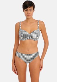 Pruhovaný bikiny set v černobílé, se skvěle tvarovaným topem s nastavitelnými ramínky a odpovídajícími spodními díly s nízkým pasem, s hladkou texturou materiálu.