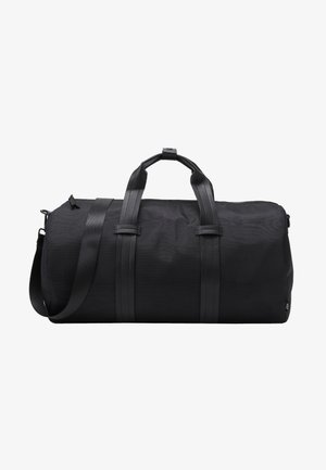 Sort duffel bag lavet af tekstureret stof med solide sorte læderremme. Har en cylindrisk form og en lynlåslukning i toppen.