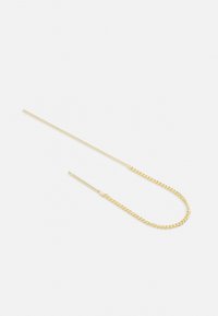 Accessoire capillaire doré avec une longue barre droite et fine, ornée d'une chaîne courbée, présentant une texture lisse et un design minimaliste.