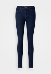 Jeans pitillo de mezclilla azul oscuro con cintura alta, cinco bolsillos y costuras de contraste. Textura suave y acabado liso.