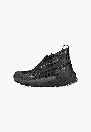 High-top athletic shoe with a black and gray leopard print design, textured rubber sole, and elastic laces for secure fitting.