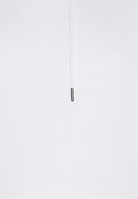 White hoodie featuring a smooth texture, a high collar, and a drawstring with a metallic accent. Simple and minimalist design.