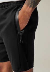 Next REGULAR FIT - Tepláky - black