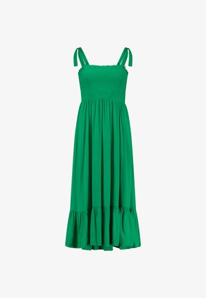 Zelené šaty so smockovanou živôtikom, tenkými ramienkami a rozšírenou sukňou s volánikom na spodnom leme. Vyrobené z ľahkej tkaniny s hladkou textúrou.