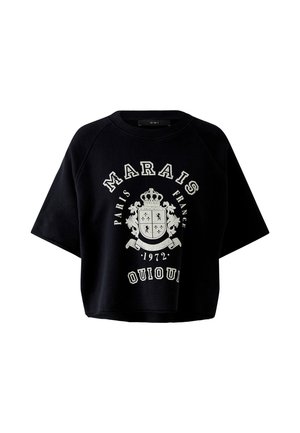 Sweat-shirt noir court avec un emblème de blason blanc et le texte "Marais Paris France 1972 Oui Oui" sur le devant, manches courtes, col rond.