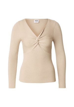 Beige geribbelde trui met lange mouwen en een gedraaide knoopdetail bij de V-hals.