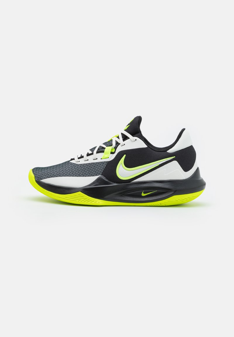 Scarpe sportive Nike con un upper in mesh bianco e nero, dettagli in giallo neon e un design della suola testurizzata per trazione e supporto.