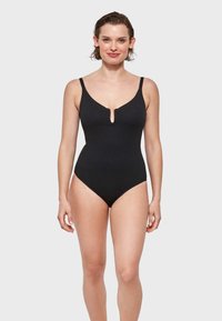 Maillot de bain une pièce noir avec un décolleté en V profond, des bretelles ajustables et des jambes échancrées. Tissu lisse et extensible sans motifs ni embellissements.