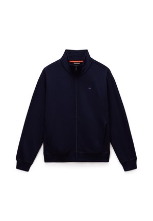 Marineblå zip-up jakke laget av myk, teksturert stoff. Har høy krage, sidelommer og ribbestrikkede mansjetter og kant for en tettsittende look.