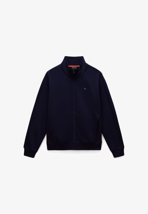 Marineblaue Zip-Jacke aus weichem, strukturiertem Stoff. Verfügt über einen hohen Kragen, seitliche Taschen und gerippte Bündchen sowie Saum für eine figurschmeichelnde Passform.