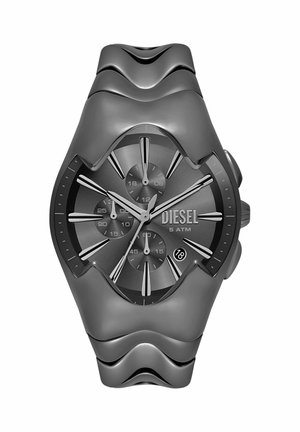 Diesel sort rustfrit ståluhr med tre sub-dials, datovindue ved kl. 4 og modigt bølgemønster på remmen.
