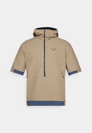 Beige short-sleeved outer jacket with a hood, featuring a front zipper, navy accents, and a logo on the chest. Smooth, waterproof material.