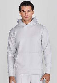 Lichtgrijze hoodie met lange mouwen, een voorvak, een verstelbare capuchon en een gladde textuur. Geen zichtbare patronen of accenten.