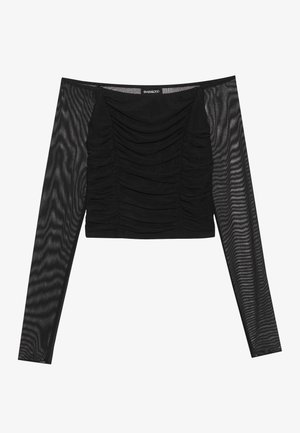 Top lung cu mânecă lungă, de culoare neagră, cu un front învolburat, un corset solid și mâneci transparente, texturate. Decolteu natural și design ajustat.
