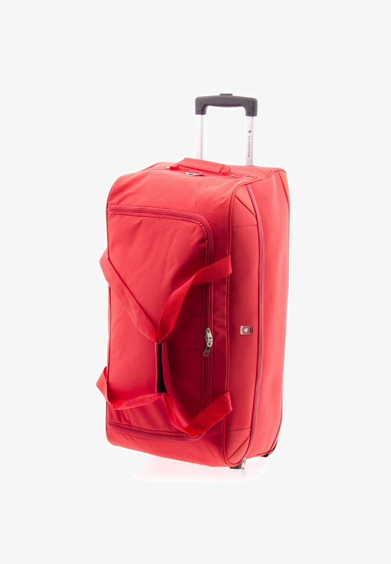 Valise à roulettes rouge avec un extérieur souple, deux poignées, une fermeture à glissière unique et des coins renforcés. Forme rectangulaire compacte.
