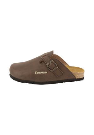 Brown closed-toe slip-on shoe with adjustable side buckle, cork footbed, and black sole, branded with "Dr. Brinkmann" logo on side.