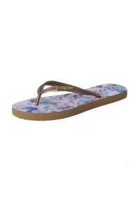 Chancla con una suela texturizada y estampada en colores pastel y una tira trenzada marrón con acentos metálicos. Perfil plano y material de goma.