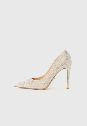 Sparkly silver high-heeled pump with a pointed toe, adorned with small glittering accents, smooth texture, and a thin stiletto heel.