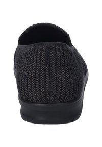 Black slip-on shoe with textured, zigzag pattern upper, elastic collar, and rubber sole. Features a rounded toe and minimalistic design.