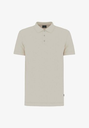 Beiges kurzärmeliges Poloshirt mit Kragen und drei Knöpfen, mit einem kleinen schwarzen Etikett am Seiten Saum.