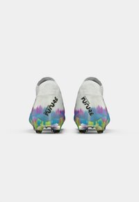 White soccer cleats with a textured finish, featuring a colorful gradient sole in blue, green, pink, and yellow. “Play Free Future” printed on the sides.