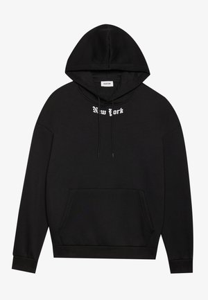 Black hoodie made of cotton with a kangaroo pocket, featuring white "New York" text above the pocket and an adjustable drawstring hood.