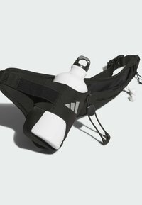 Black running belt with a white water bottle holder. Features adjustable strap, elastic cord, and reflective logo. Earphones attached.