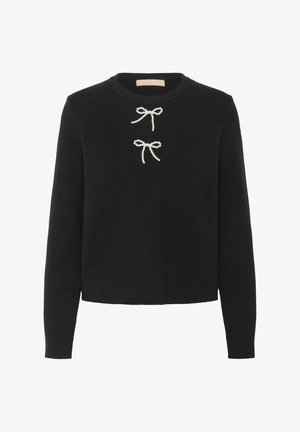 Crna pulover s dugim rukavima, okruglim izrezom i dva bijela luka ukrašena biserima sprijeda. Mekana tekstura i skraćeni dizajn.