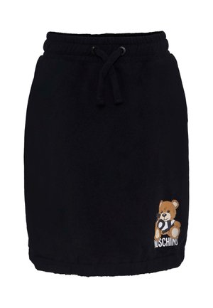 Falda de forro polar negra con cintura elástica, cordón ajustable y un gráfico de un oso impreso en la parte delantera. Textura suave y diseño informal.