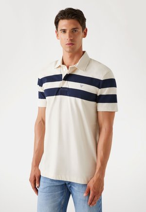 Polo shirt in cream with navy horizontal stripes. Features a collar, three-button placket, and a small logo above the chest pocket.