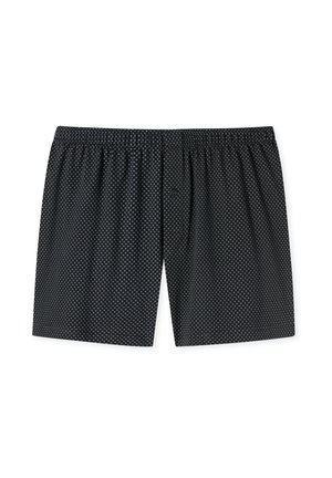 Zwarte onderbroeken van zachte stof, met een patroon van witte stippen, een elastische tailleband en een enkel knoopgulp.