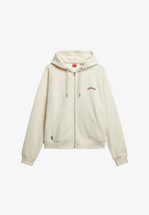 Cream zip-up hoodie made from soft material, featuring a front pocket, drawstring hood, and red "Superdry" embroidery on the chest.
