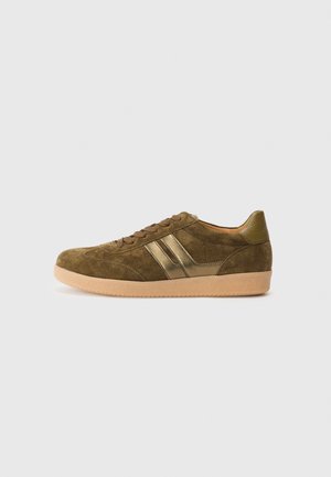 Green suede sneakers with gold stripes, round toe, and brown rubber sole. Features laces and a textured heel for added grip.
