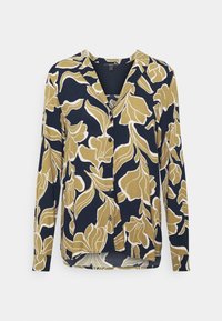 Blusa de manga larga en azul marino con un patrón floral abstracto en mostaza y blanco. Presenta un escote en V y botones en el frente. Textura de tela suave.