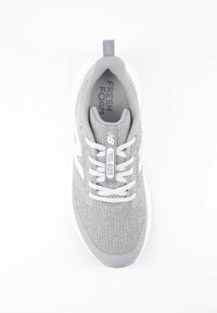 Gray mesh athletic shoe with white accents, featuring a cushioned sole, lace-up design, and a pull tab on the heel. "Fresh Foam" branding visible.
