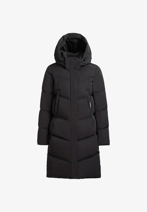 Musternimust ja kõrge kraega must pufferjope, millel on eesnupud, kaks küljetaskut ning tikand, millel on horisontaalsed triibud.