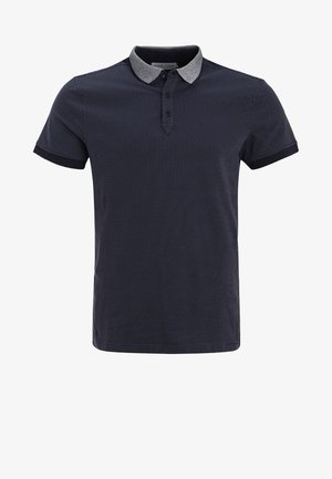 Navy polo shirt with a grey collar, short sleeves, and a micro-dotted pattern. Features three buttons at the neckline and solid hem accents.