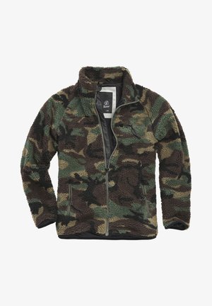 Flis jakna z zadrgo v vzorcu kamuflaže. Ima zelene, rjave in peščene odtenke, dva žepa z zadrgo in visok ovratnik.