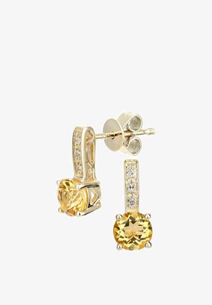 Kullavärvi kõrvarõngad, millel on ümmargused kollased vääriskivid ja selged aktsentkivid dekoratiivse tihvti peal. Sile pind poleeritud viimistlusega.