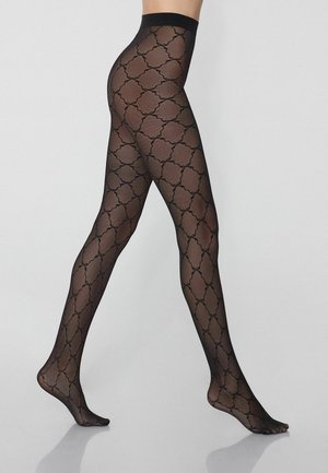 Collant neri con motivo a pattern geometrico intricatamente dettagliato. Il materiale è trasparente con una texture liscia, vita alta e piede aperto.